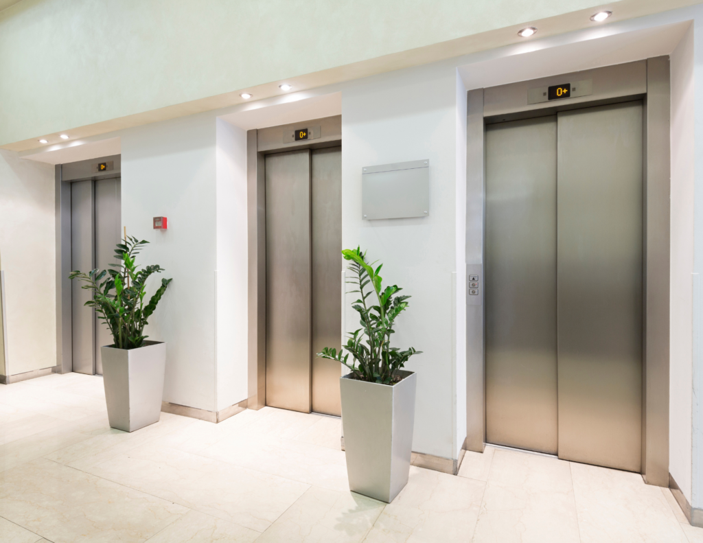 three elevators with plants