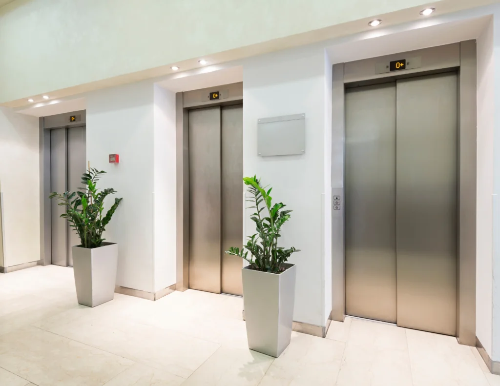 three elevators with plants
